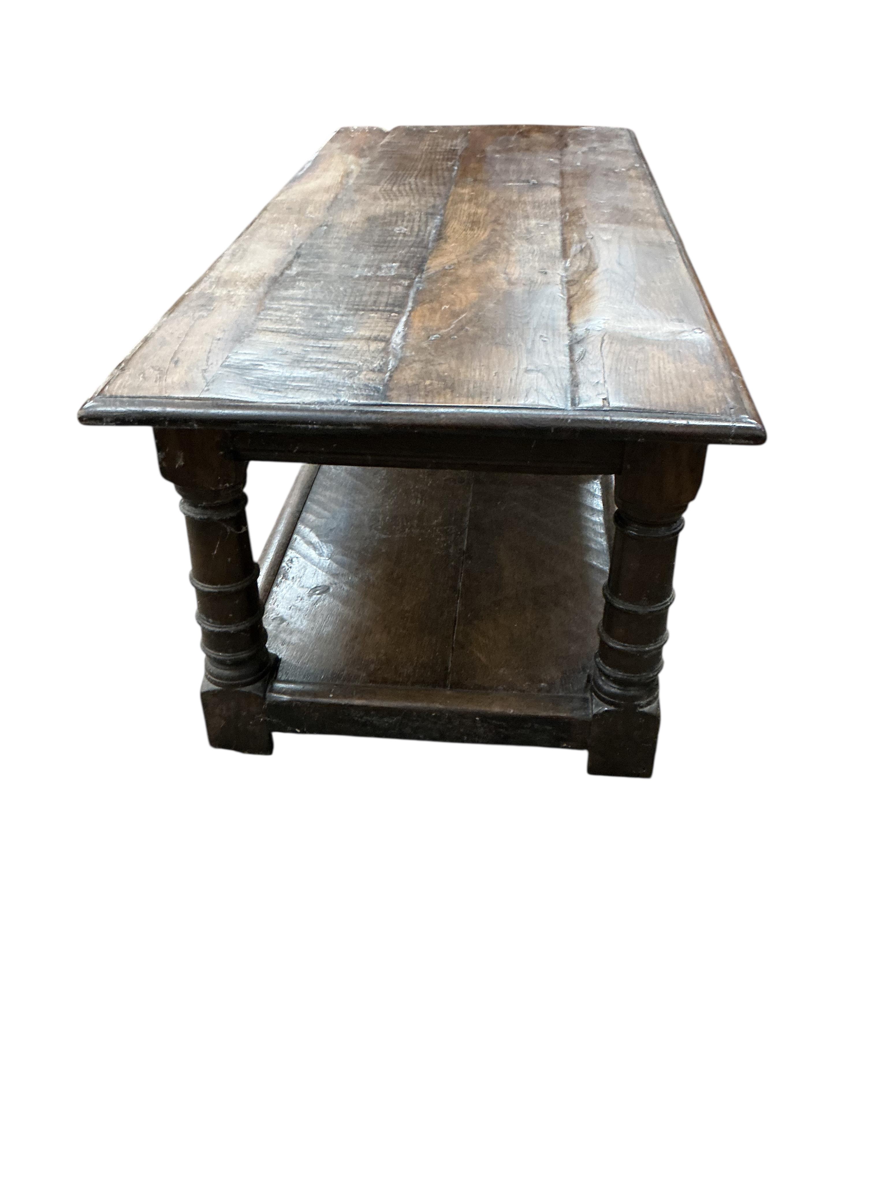 An 18th century style rectangular oak two tier coffee table, width 122cm, depth 50cm, height 43cm